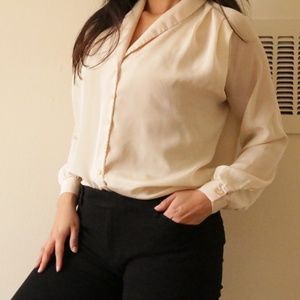 buttoned-up beige top